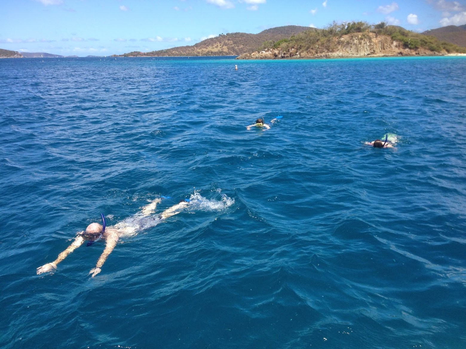 a man riding a wave on top of a body of water