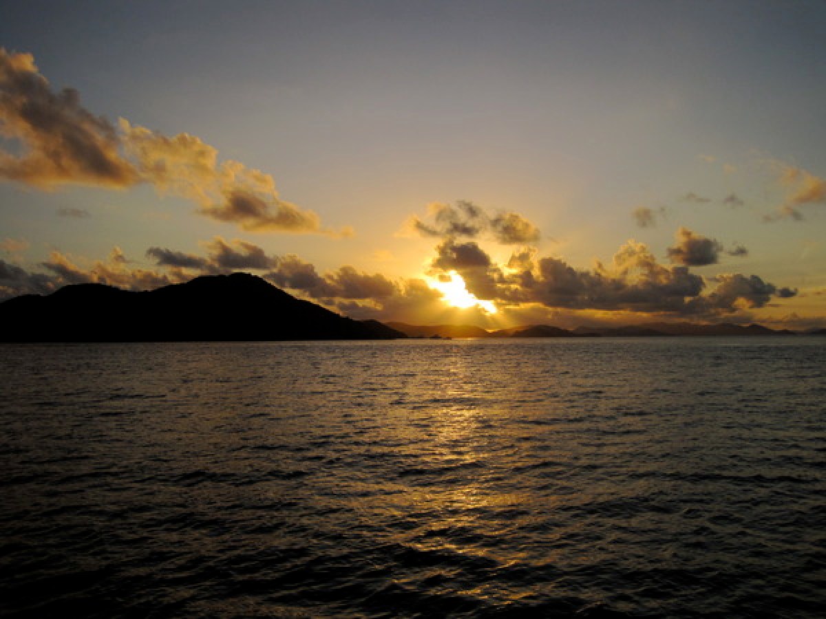 a sunset over a body of water