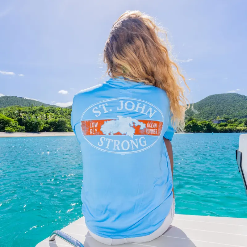 a person sitting next to a body of water