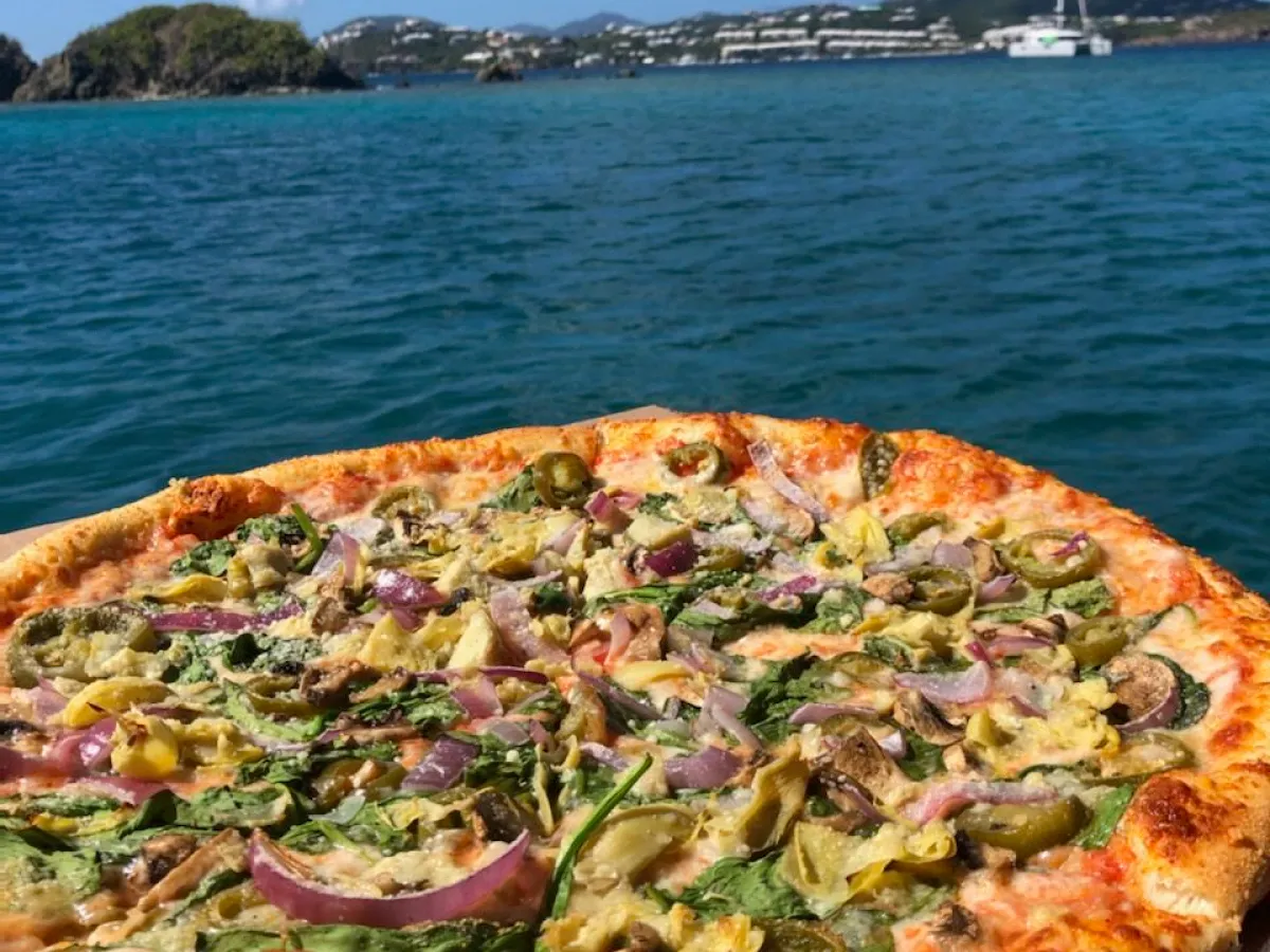 a pizza sitting on top of a table
